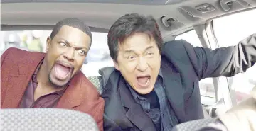  ??  ?? Jackie with Chris Tucker in ‘Rush Hour 3’.