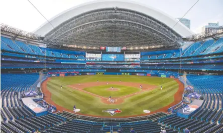  ?? CARLOS OSORIO / THE CANADIAN PRESS ?? The Toronto Blue Jays played their intrasquad game on Thursday in a nearly empty Rogers Centre.