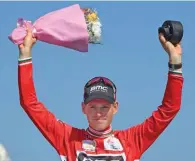  ?? – AFP ?? THE CHAMPION: BMC Racing Team’s Belgian rider Ben Hermans celebrates on the after emerging the overall winner of 2017 Tour of Oman at Muttrah Corniche on Sunday.