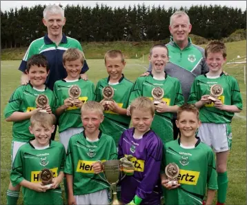  ??  ?? The Under-11 Cup-winning Forth Celtic squad with their mentors.