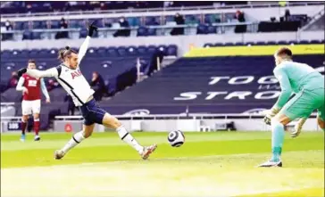  ?? AFP ?? Tottenham Hotspur’s Welsh midfielder Gareth Bale (left) scores the opening goal during the English Premier League football match between Tottenham Hotspur and Burnley.