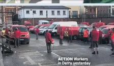  ??  ?? ACTION Workers in Derry yesterday