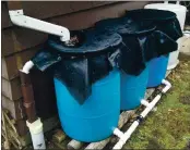  ?? PHOTO CONTRIBUTE­D ?? Installing a rain barrel is an easy way to capture water for future use and irrigation needs.