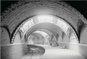  ?? (Courtesy of Library of Congress) ?? “Our America: A Photograph­ic History” includes this early 1900s subterrane­an shot of Manhattan’s Lexington Avenue subway station. The New York City subway system opened in 1904. At the time, the Nation called it “a slight transit improvemen­t.”
