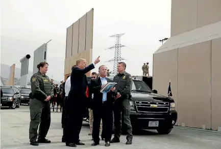  ?? PHOTO: AP ?? US President Donald Trump inspects border wall prototypes with Customs and Border Protection officials at Otay Mesa Point of Entry, near San Diego.