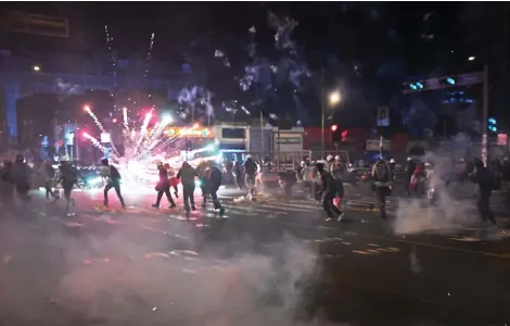  ?? — AFP photo ?? Protesters set off fireworks during a demonstrat­ion against the government of Boluarte in Lima.