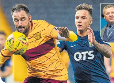  ??  ?? Motherwell’s Peter Hartley, left, and Eamonn Brophy of Killie battle for possession