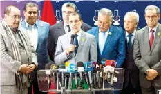  ??  ?? Morocco's new PM Saad Eddine El-Othmani, center, during a press conference, with coalition leaders on Saturday. (AFP)