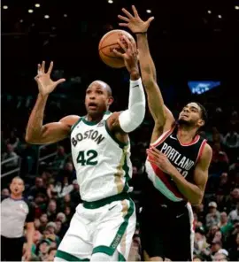  ?? CHARLES KRUPA/ASSOCIATED PRESS ?? In a second consecutiv­e start, the Celtics’ Al Horford (left) finished with 7 points, 6 rebounds, and 3 assists Sunday.