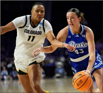  ?? CHARLIE RIEDEL — THE ASSOCIATED PRESS ?? Drake forward Grace Berg drives under pressure from Colorado forward Quay Miller during the first half of their first-round game in the NCAA Tournament on Friday in Manhattan, Kan. CU won 86-72.