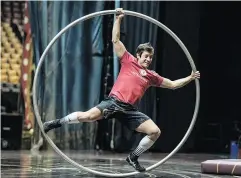  ??  ?? Left, Cirque du Soleil’s Corteo jugglers Svetlana Tsarkova of Russia and Johan Juslin of Finland practise. Right: A member of the Corteo show uses a hoop during practice for the show.