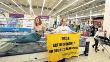  ?? /Reuters ?? Awareness: Greenpeace activists demonstrat­e for sustainabl­e seafood policy in this file picture. Labelling seafood raises awareness about conservati­on.