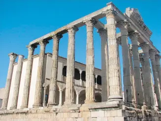  ??  ?? The 2,000-year-old Temple of Diana is one of the best preserved Roman monuments that fill Merida, Spain. In a sign of Merida’s fusion of the Roman and the Spanish empires, the temple was incorporat­ed into a porticoed Renaissanc­e palace.