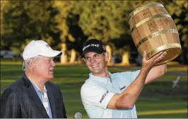  ?? ERIC RISBERG / ASSOCIATED PRESS ?? Brendan Steele (right, with Hall of Famer Johnny Miller) holds up the trophy after his second consecutiv­e Safeway Open victory on Sunday.