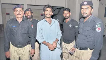  ?? AP ?? Pakistani police officers present Waseem Azeem, the brother of slain model Qandeel Baloch, before the media following his arrest at a police station in Multan, Pakistan, on Saturday. Pakistani police say he confessed to strangling her to death for...