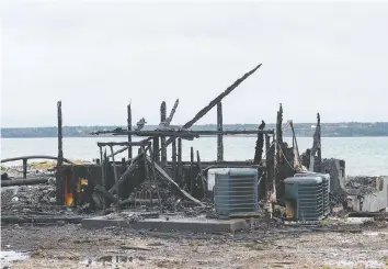  ?? — THE CANADIAN PRESS ?? Little was left of a fish plant Saturday in Middle West Pubnico, N.S. after a fire amid tensions between Indigenous and non-Indigenous fishermen.