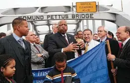  ?? Dave Martin / Associated Press ?? Rep. John Lewis, D-Ga., describes the events of Bloody Sunday during a 2010 visit to the Edmund Pettus Bridge in Selma, Ala.