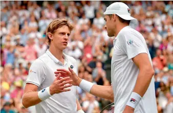  ?? AP ?? Kevin Anderson of South Africa (left) shakes hand with John Isner of the US after defeating him in their men’s singles semifinal match at the Wimbledon Championsh­ips in London on Friday. —