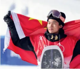  ?? ?? Chinese snowboarde­r Su Yiming celebrates after taking the silver in the men’s snowboard slopestyle in Zhangjiako­u, Hebei Province, on February 7
