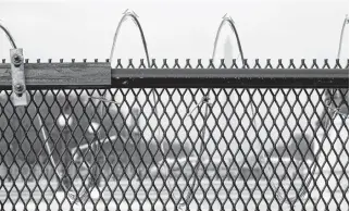  ?? JOSHUA ROBERTS • REUTERS ?? Barb wire is seen on a fence surroundin­g the U.S. Capitol on Friday.