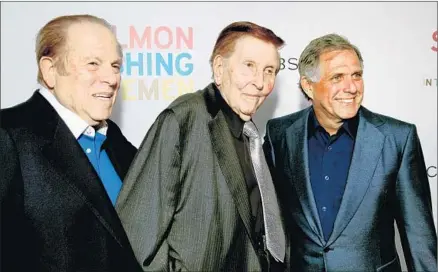  ?? Alex J. Berliner ABImages ?? SUMNER REDSTONE, center, controls CBS and Viacom but it’s unclear whether he has the mental capacity to authorize a suit filed on his behalf or make business decisions. With him are CBS board member Arnold Kopelson, left, and CBS chief Leslie Moonves.