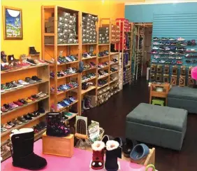  ??  ?? At GoldenBug Children’s Shoes, shoppers are steering away from dressed-up styles