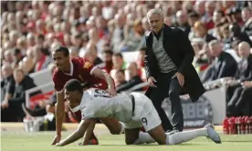  ?? Photograph: Tom Jenkins/The Guardian ?? José Mourinho, then Manchester United manager, watches Marcus Rashford tussle for the ball with Liverpool’s Joël Matip in October 2017.