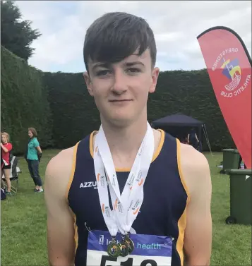  ??  ?? Jack Forde of St. Killian’s at the national Juvenile championsh­ips. He won the Under-15 triple jump with a P.B. of 11.14m, picked up a silver in the high jump (1.68m), and completed the set with a bronze in the shot putt with another P.B. (14.27m).