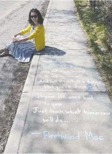  ?? CHRIS PURTILL ?? Lana Filipic is writing inspiratio­nal quotes on the sidewalks of her Calgary neighbourh­ood to spread positivity during tough times.