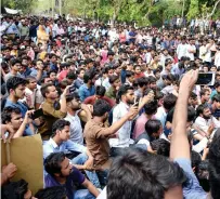  ?? PTI ?? Aligarh Muslim University students stage a protest at the gate of their campus in Aligarh. —