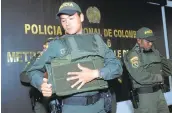  ?? LUIS BENAVIDES/ASSOCIATED PRESS ?? Police put on bulletproo­f vests before leaving a police station to patrol the streets of Medellin, Colombia, on Friday.