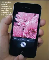  ??  ?? Siri, Apple’s virtual assistant, is displayed on the Apple iPhone 4S in San Francisco.