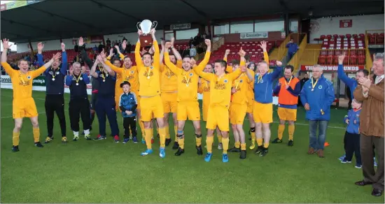  ??  ?? Players and coaches from Manor Rangers celebrate after winning the Northwest Hospice final after defeating Ballisodar­e 3- 2 in the Showground­s on Saturday.