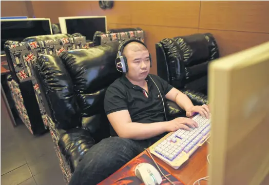  ??  ?? CRACKDOWN: An internet cafe in Beijing. China’s controvers­ial cybersecur­ity law, implemente­d on June 1, has hit the country’s top internet firms.
