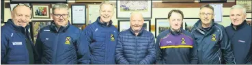 ?? ?? Thomas ‘Waxer’ Murphy, groundsman at St Catherine’s GAA for 7 years, pictured with members of the executive committee.
