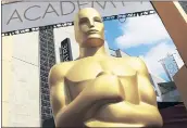  ?? INVISION / THE ASSOCIATED PRESS ?? The Oscars organizati­on is adding a new category to honor popular films and promising a three-hour ceremony.