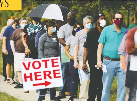  ?? JONATHAN DRAKE / REUTERS / FILES ?? Voters wait to cast their ballots in early voting for the U.S. election, which has seen a widening chasm between Democrat and Republican supporters.