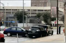  ?? [ROBERT MEDLEY/THE OKLAHOMAN] ?? Numerous wrecks were reported across Oklahoma City due to icy streets Wednesday morning. This car crashed after the driver lost control on Broadway Avenue at NW 4 in downtown.