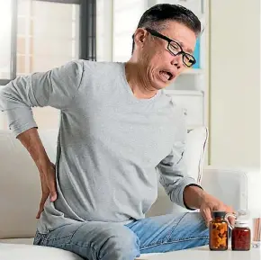  ??  ?? Most back pain resolves with rest, anti-inflammato­ry medication – and continuing to move. Sitting can make it worse.