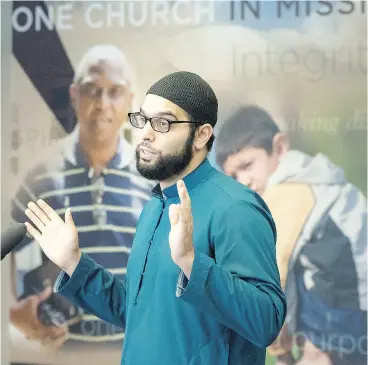  ?? PETER J THOMPSON / NATIONAL POST ?? Iman Ibrahim Hindy of the Dar Al-Tawheed Islamic Centre speaks to reporters after a meeting of religious groups about the Canada Summer Jobs grant at the Pentecosta­l Assemblies of Canada location in Mississaug­a, Ont., Tuesday.