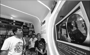  ?? LONG WEI / FOR CHINA DAILY ?? A visitor takes part in an interactiv­e game supported by Ant Financial’s facial recognitio­n technology at a high-tech products exhibition in Hangzhou, Zhejiang province.