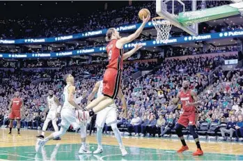  ?? CHARLES KRUPA/AP ?? Kelly Olynyk sustained a hyperexten­ded knee, a sore ankle and multiple bruises after an ugly tumble after a dunk in Wednesday’s road victory over the Boston Celtics.