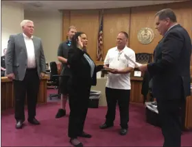  ?? CARL HESSLER JR. — MEDIANEWS GROUP ?? Karissa Rivera, 22, of Horsham, takes the oath of office as a Montgomery County deputy sheriff. Rivera’s mentor, retired Las Vegas Police Sgt. William Stockdale, (far left) surprised her by attending the ceremony. Sheriff Sean Kilkenny (far right) administer­s the oath.