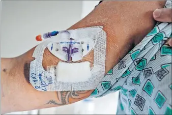  ?? [BARBARA J. PERENIC/DISPATCH] ?? A PICC line delivers antibiotic­s into a patient’s arm.