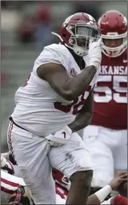  ?? (NWA Democrat-Gazette/Charlie Kaijo) ?? Alabama defensive lineman Christian Barmore celebrates after sacking Arkansas quarterbac­k KJ Jefferson during the third quarter Saturday. The Hogs surrendere­d eight sacks during the game.