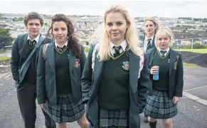  ??  ?? Derry Girls cast members, and (right) Kevin McAleer as Uncle Colm with co-star Siobhan McSweeney, who plays Sister Michael