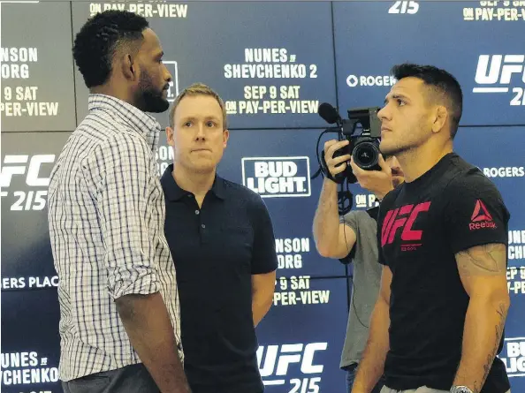  ?? LARRY WONG ?? Welterweig­hts Neil Magny, left, and Rafael dos Anjos stare each other down on Wednesday at Rogers Place ahead of their bout at UFC 215 on Saturday. There’s plenty at stake for the two fighters, writes Terry Jones, and the bout promises to be one of the...