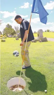  ??  ?? Ron Patel juggles the ball while playing foot golf at Santa Ana Golf Course .