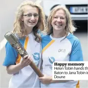  ??  ?? Happy memory Helen Tobin hands the Baton to Jana Tobin in Doune