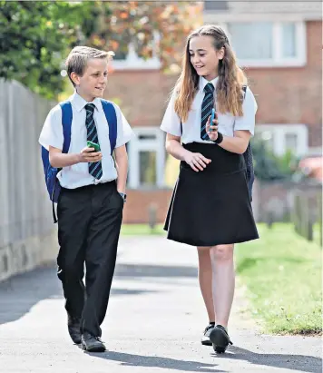  ??  ?? An increasing number of children have long distances to get to school and parents are turning to GPS trackers for peace of mind